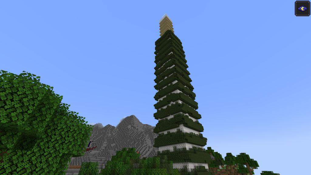 A screenshot of minecraft depicting a tower of birch trees in front of mountains that appear diminutive in comparison.