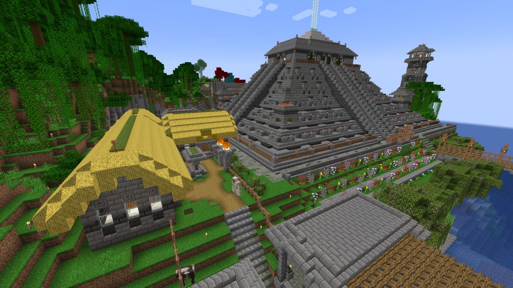 A screenshot of minecraft showing modded blocks from the Decorative Blocks mod, like thatch on the roof of a hut in the foreground, an fancy fences on a ziggurat in the middle-distance.