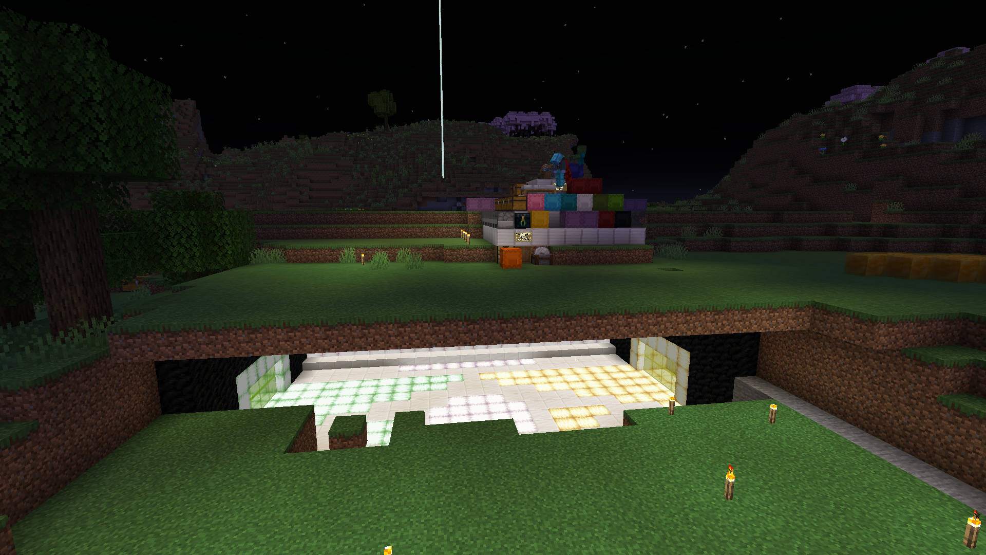 A screenshot of Minecraft showing a bunker with no entrance and a mess of shulkers atop a beacon in the darkness.