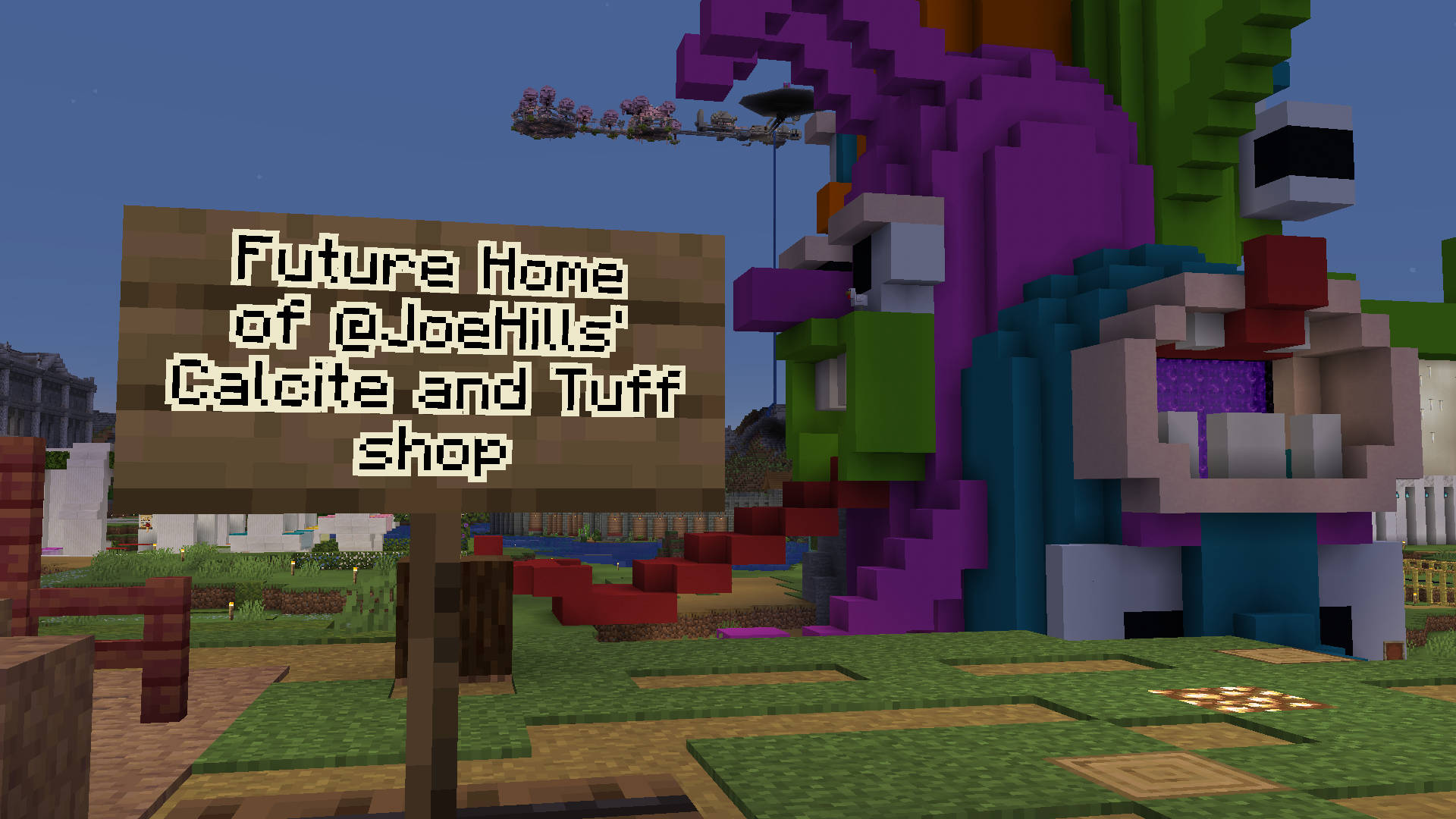 A screenshot of Minecraft showing a sign in front of of creepy cartoonish portal in the HermitCraft 10 shopping district. The sign reads: "future home of @JoeHills' Calcite and Tuff shop.