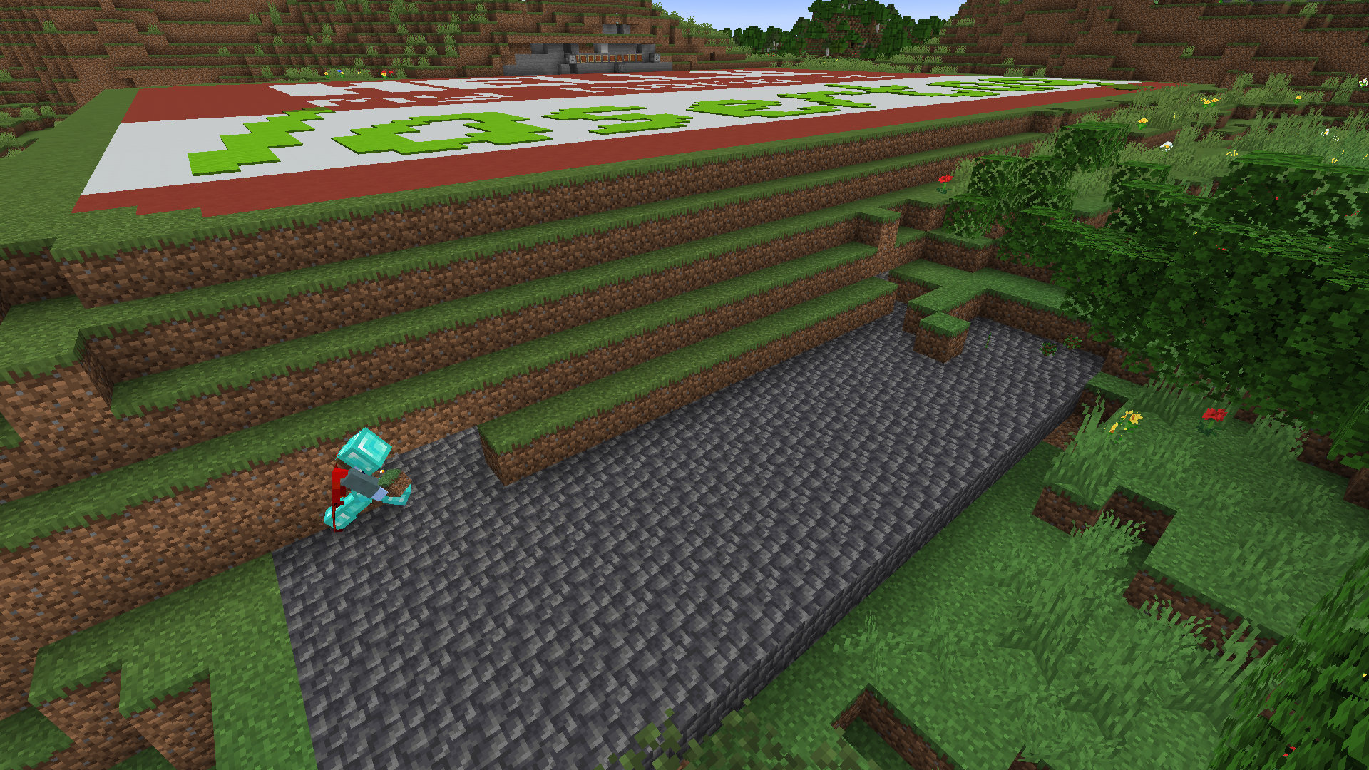 A screenshot of Minecraft showing Joe Hills building a roof for the storage area of his bunker. The inner liner is depilate and Hills is layering grass over that.